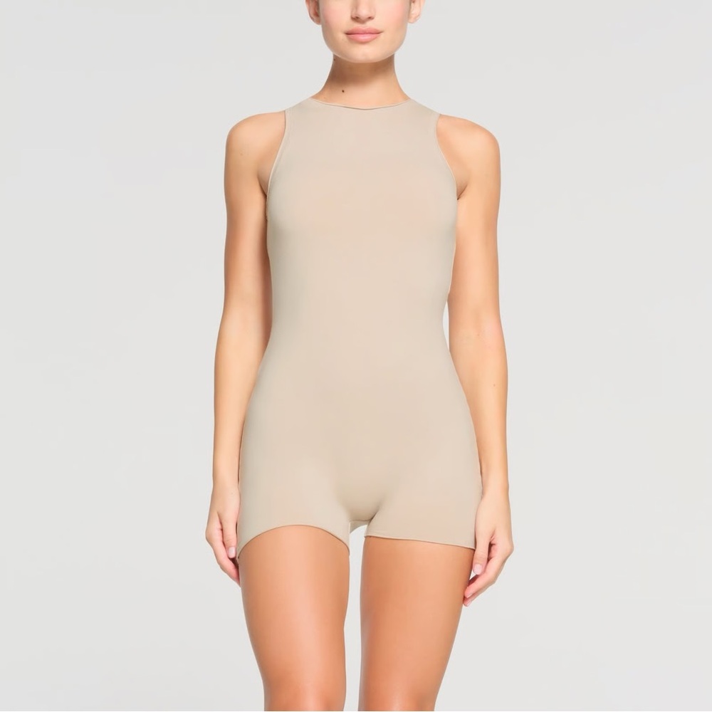 Skims ‘Stone’ Raw Edge Onesie